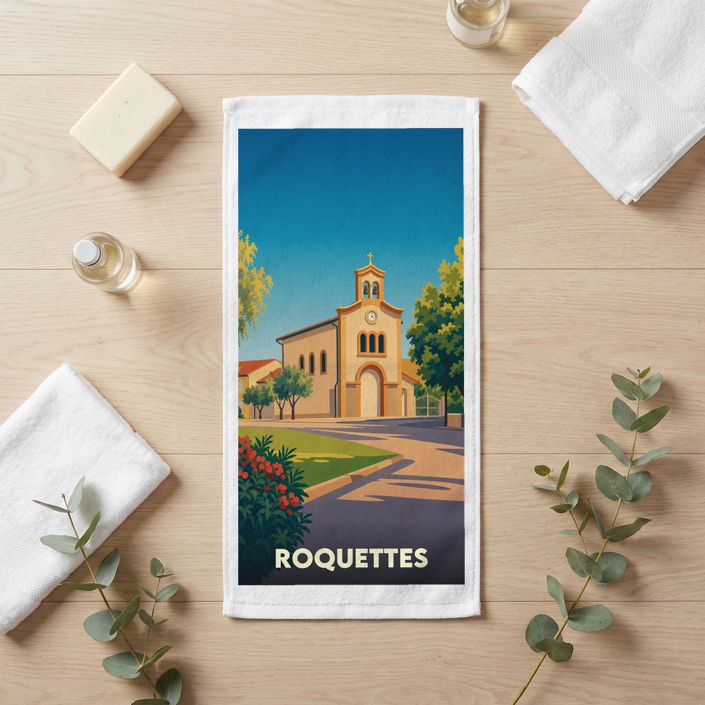 Serviette de bain souvenir de la ville de Roquettes avec une illustration stylisée de son église.