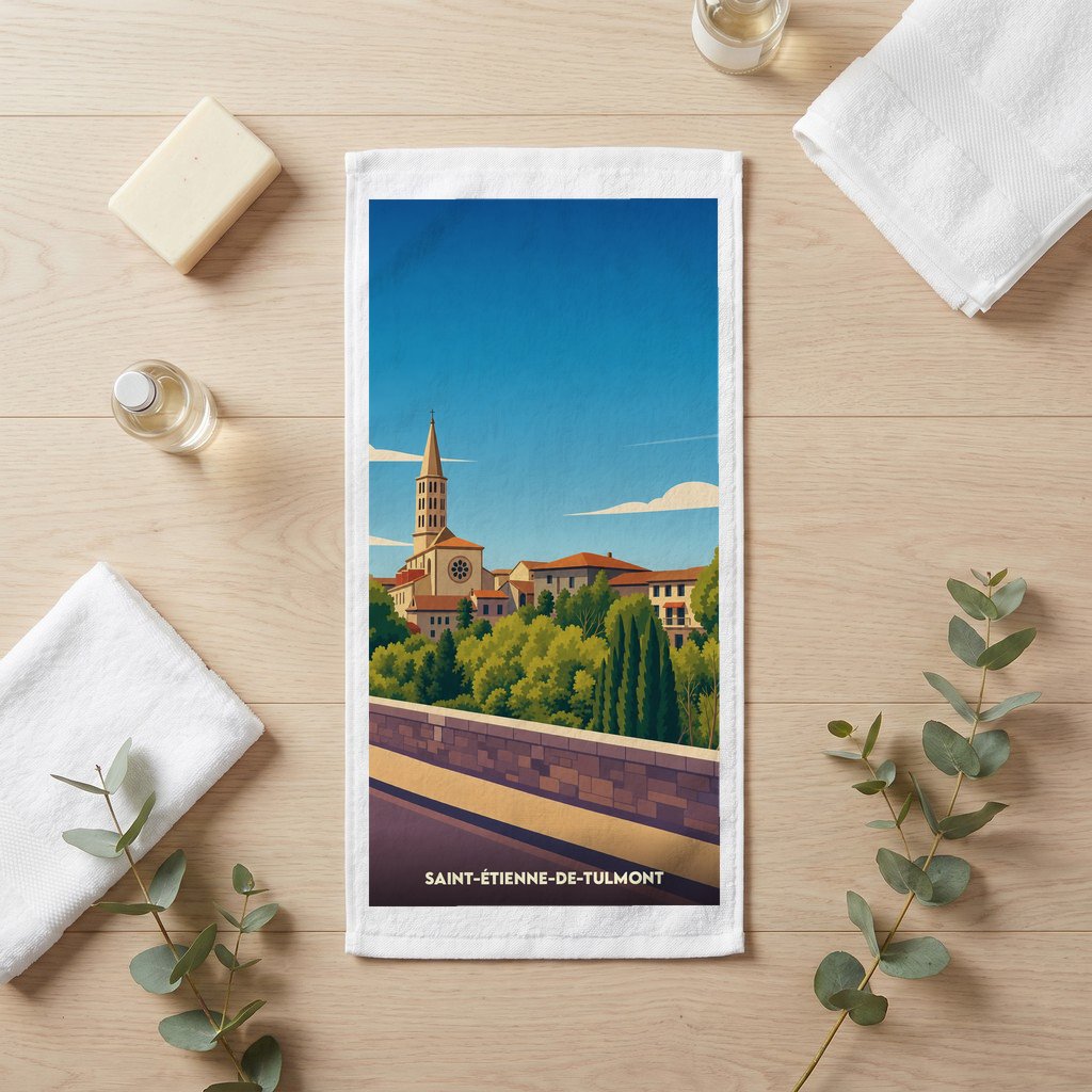 Serviette de toilette souvenir de Saint-Étienne-de-Tulmont avec une illustration de la ville et de son église.
