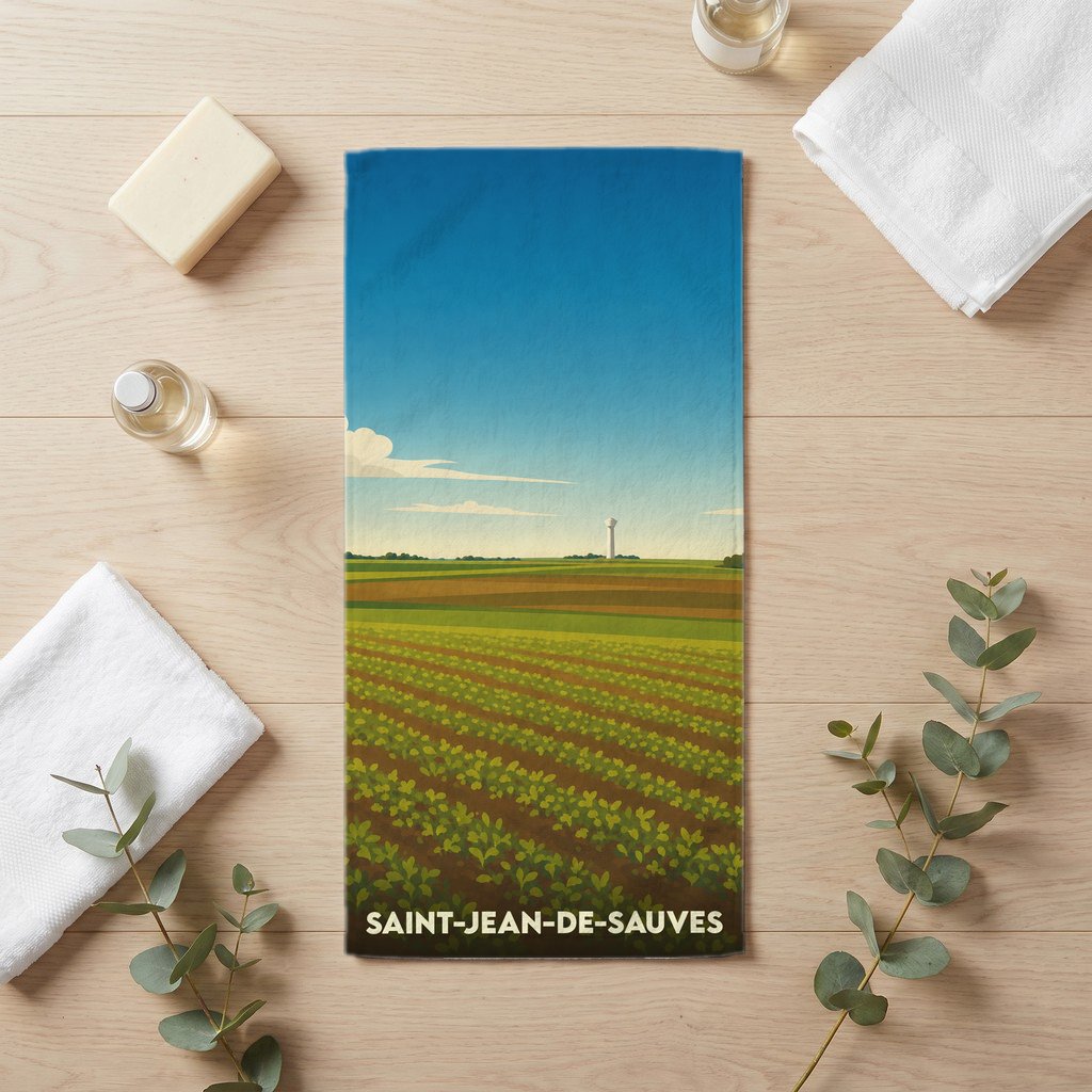 Serviette de bain souvenir de la ville de Saint-Jean-de-Sauves avec une illustration stylisée de champs agricoles.