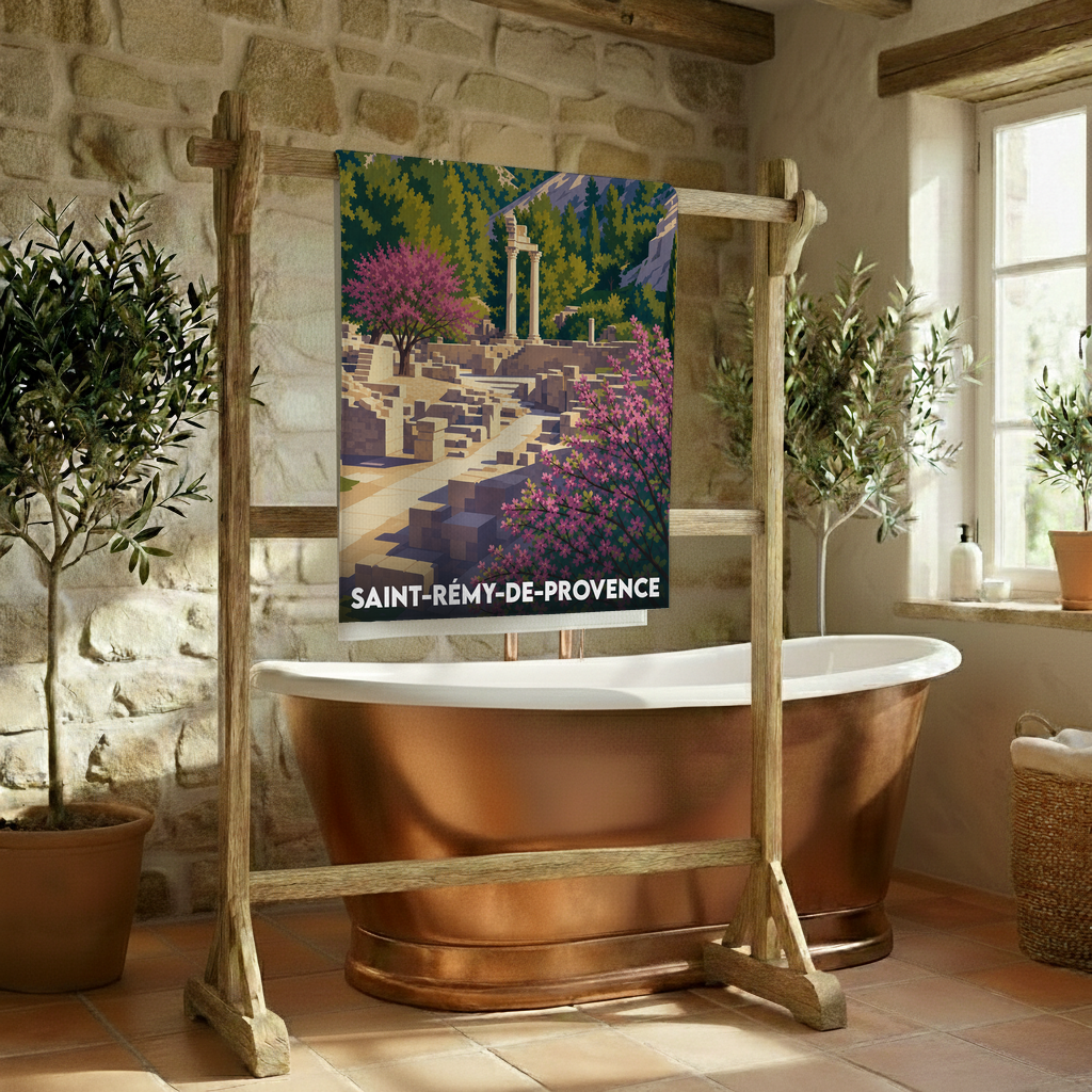 Serviette de bain souvenir de Saint-Rémy-de-Provence illustrée d'un paysage provençal stylisé avec des ruines antiques.
