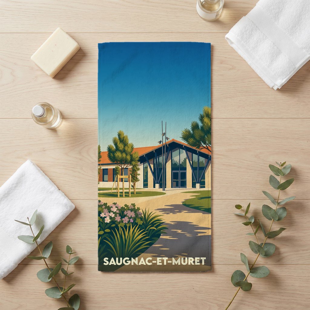 Serviette de bain souvenir de Saugnac-et-Muret avec une illustration stylisée d'un bâtiment moderne.