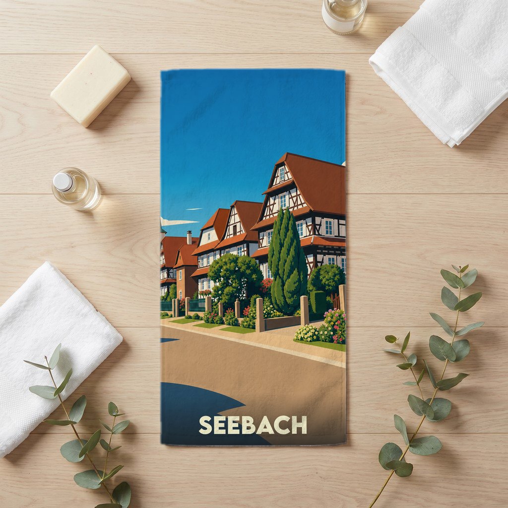 Serviette de bain souvenir de la ville de Seebach avec une illustration stylisée de maisons à colombages.