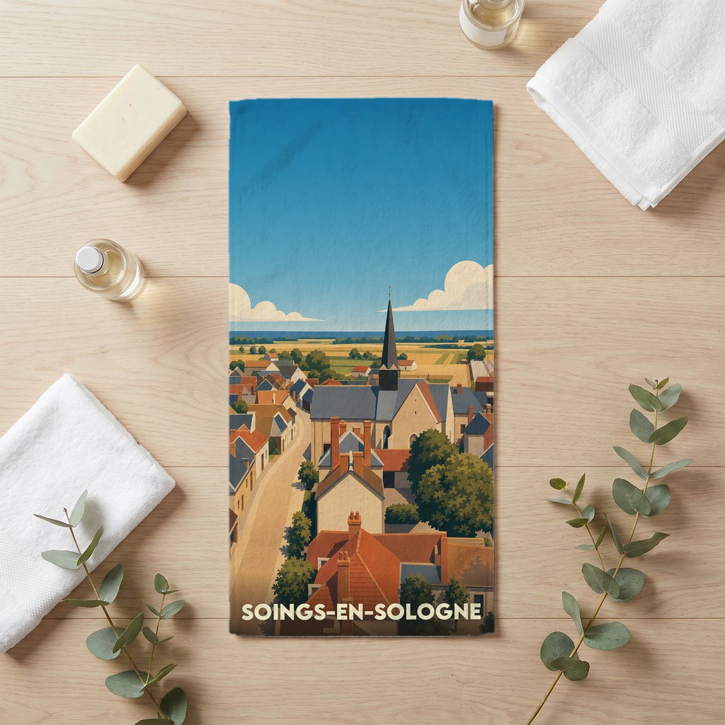 Serviette de bain souvenir de la ville de Soings-en-Sologne avec une illustration stylisée d'un village français.
