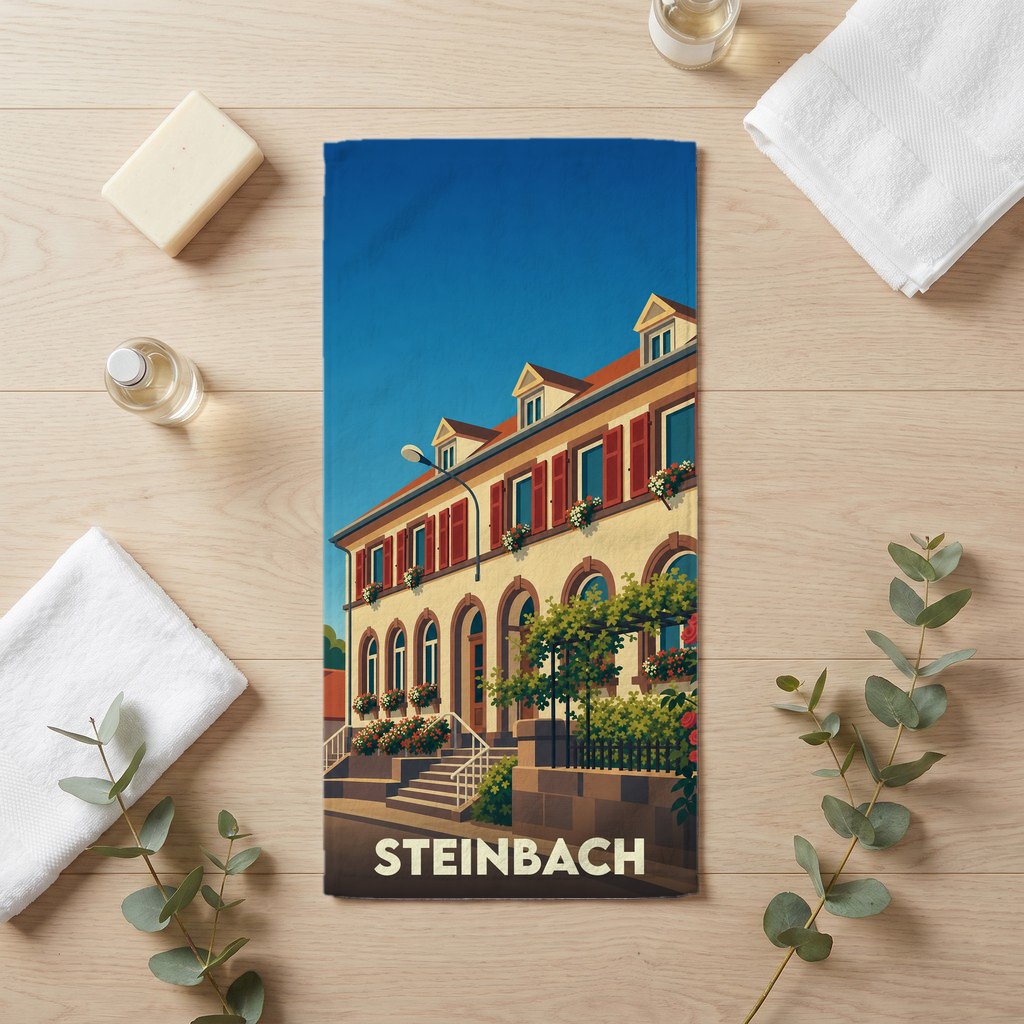 Serviette de bain souvenir de la ville de Steinbach avec une illustration stylisée.