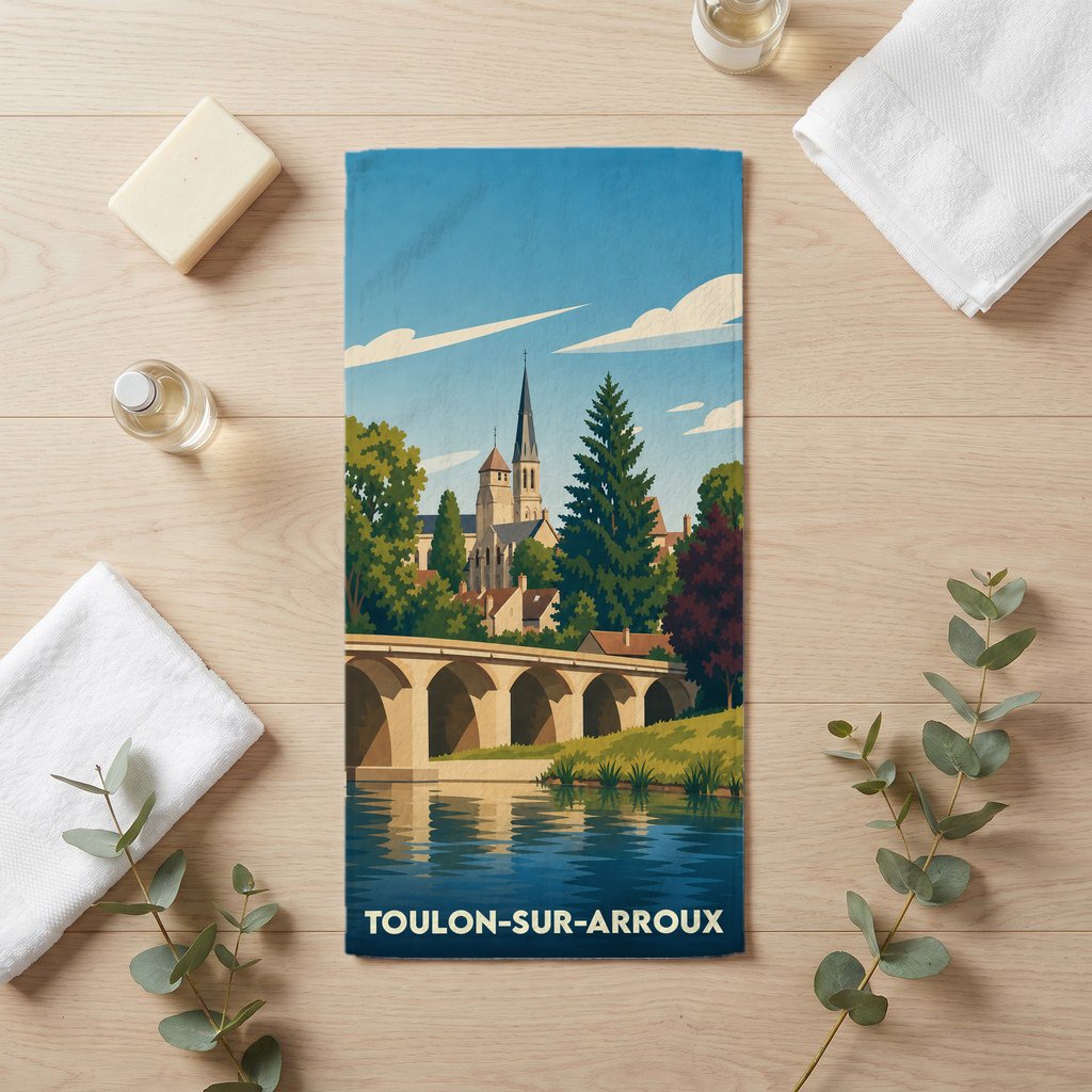 Serviette de bain souvenir de la ville de Toulon-sur-Arroux avec une illustration stylisée.