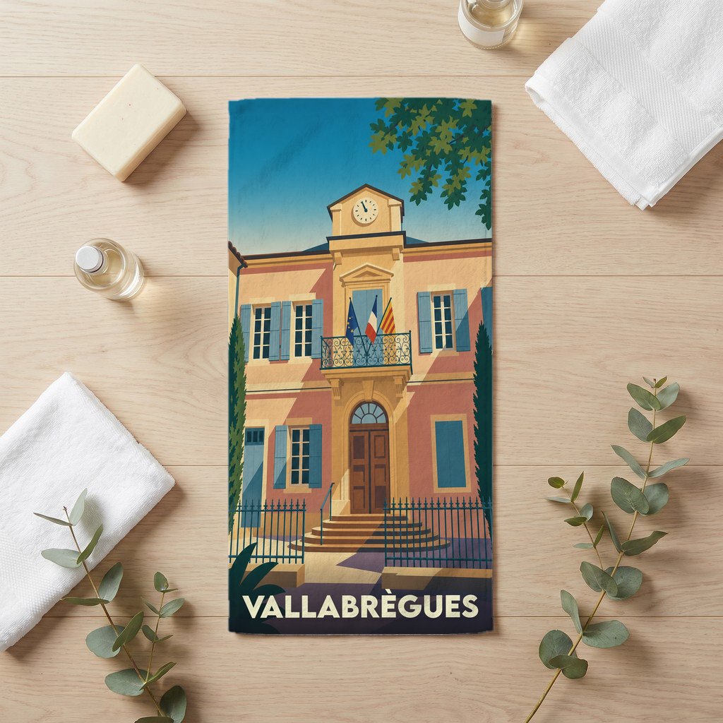 Serviette de bain souvenir de la ville de Vallabrègues avec une illustration stylisée de la mairie.