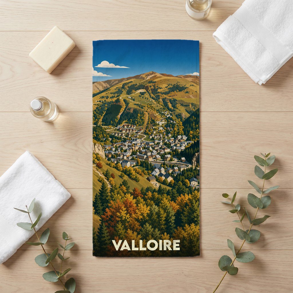 Serviette de bain souvenir de la ville de Valloire avec une illustration stylisée d'un paysage de montagne.