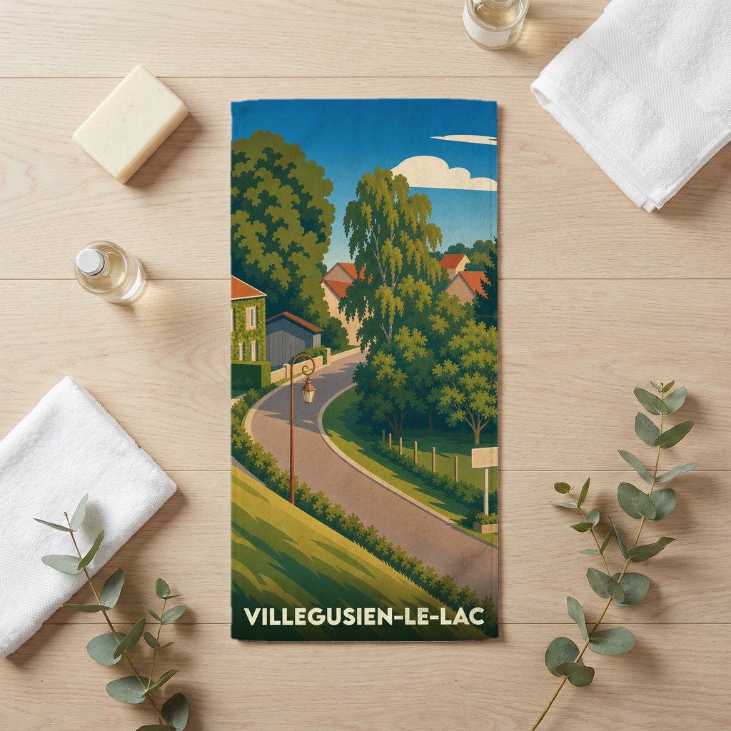 Serviette de bain souvenir de Villegusien-le-Lac illustrée d'un paysage de village pittoresque.