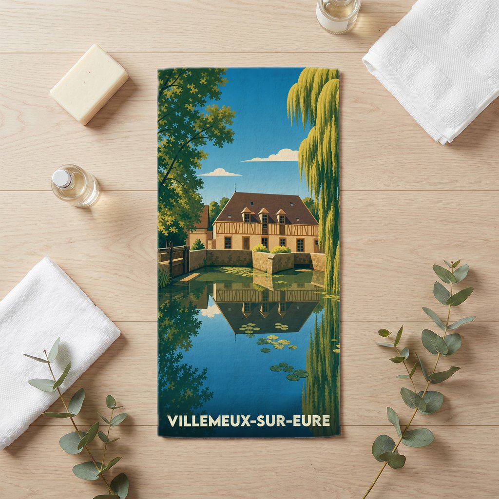 Serviette de bain souvenir de la ville de Villemeux-sur-Eure avec une illustration stylisée d'un moulin au bord de l'eau.