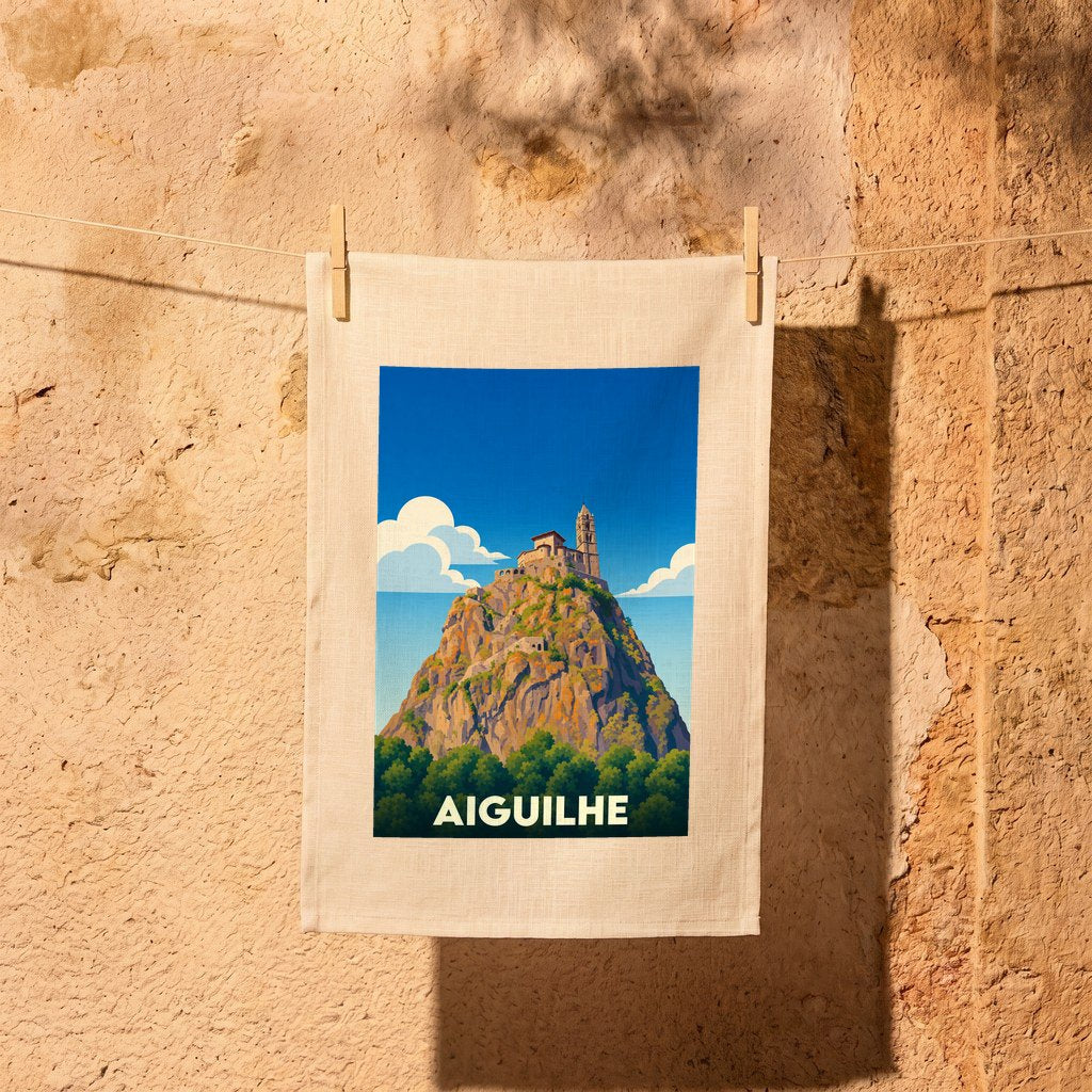 Torchon souvenir de la ville d'Aiguilhe avec une illustration stylisée de son église perchée.