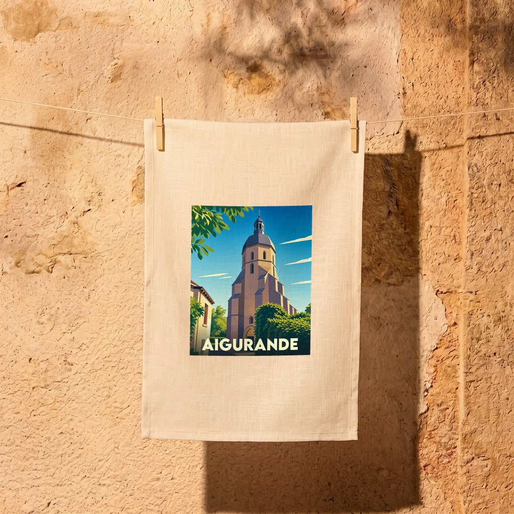 Torchon souvenir de la ville d'Aigurande avec une illustration stylisée de son église.