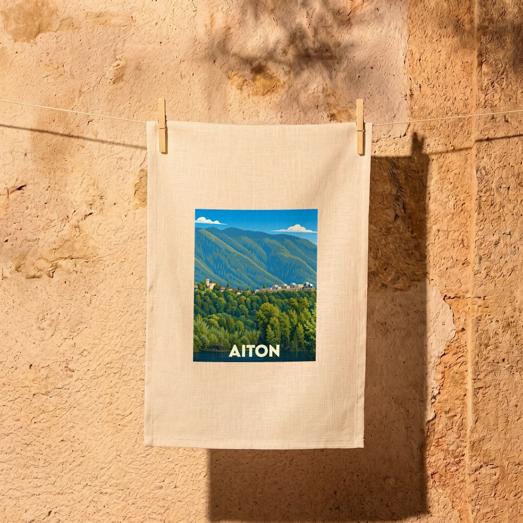 Torchon souvenir de la ville d'Aiton orné d'une illustration paysagère stylisée.