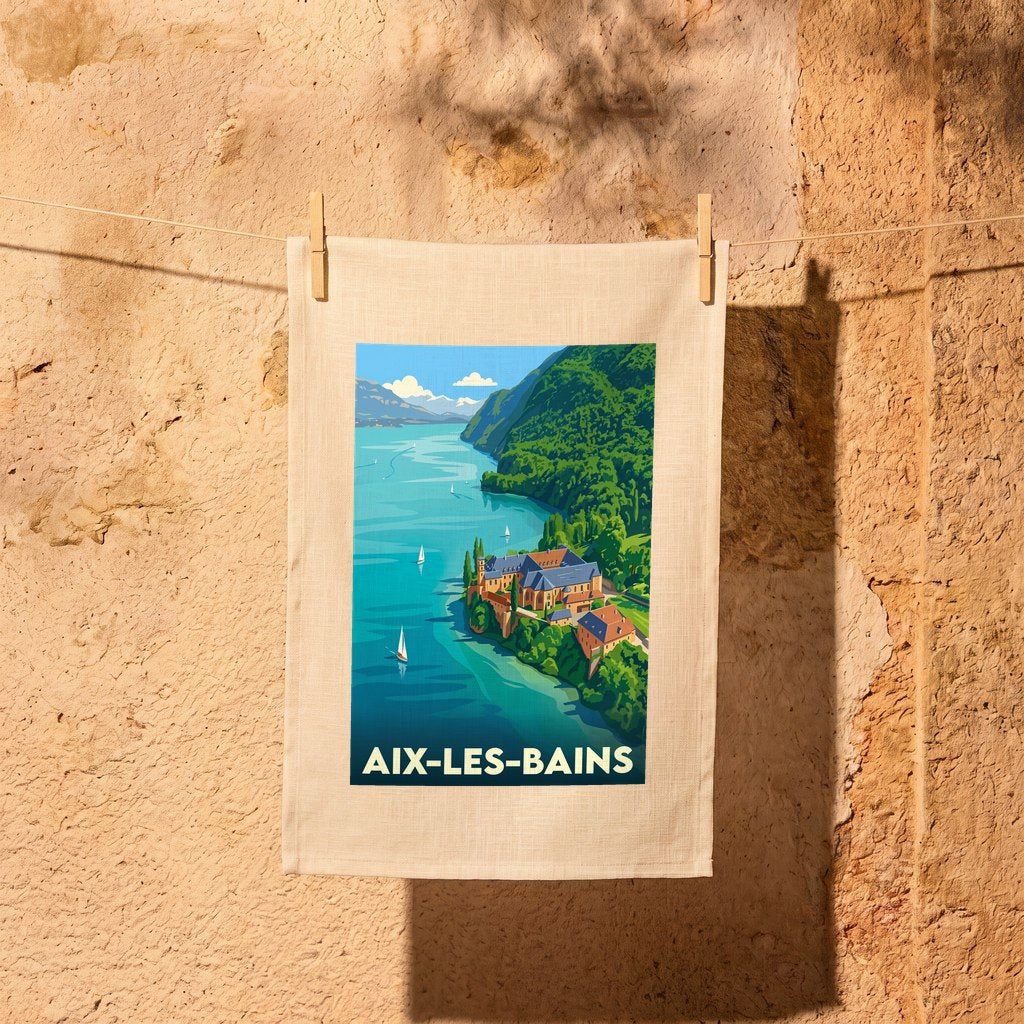 Torchon souvenir de la ville d'Aix-les-Bains avec une illustration stylisée du lac et de l'abbaye.