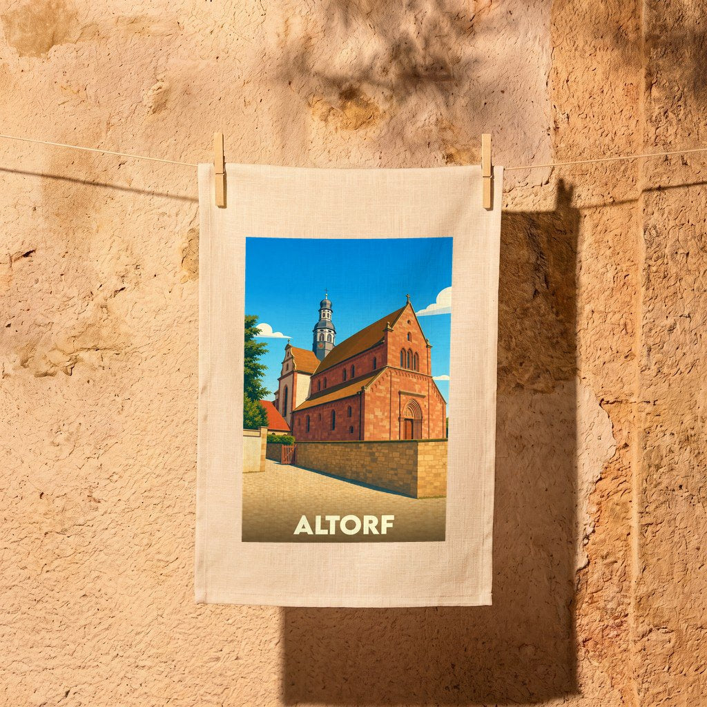 Torchon souvenir de la ville d'Altorf avec une illustration stylisée de son église abbatiale.