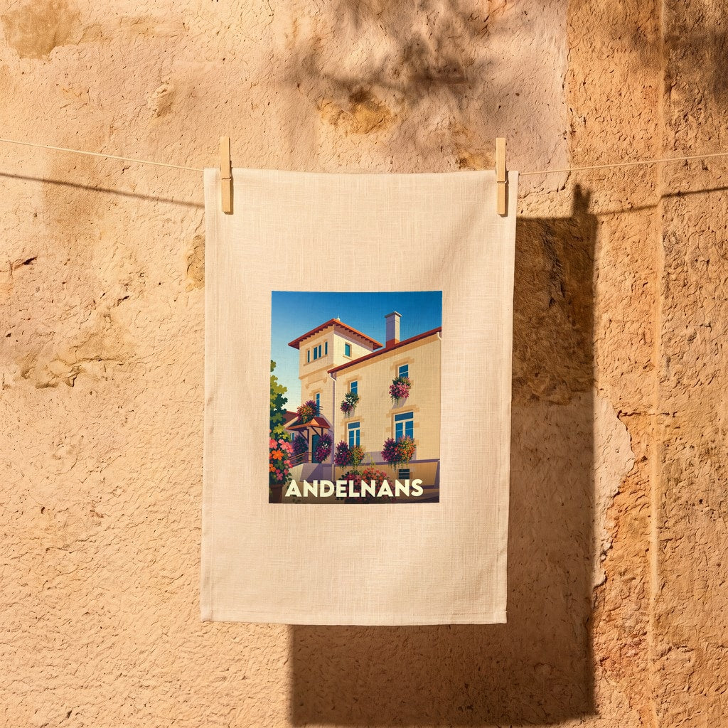 Torchon souvenir de la ville d'Andelnans orné d'une illustration stylisée d'une bâtisse fleurie.