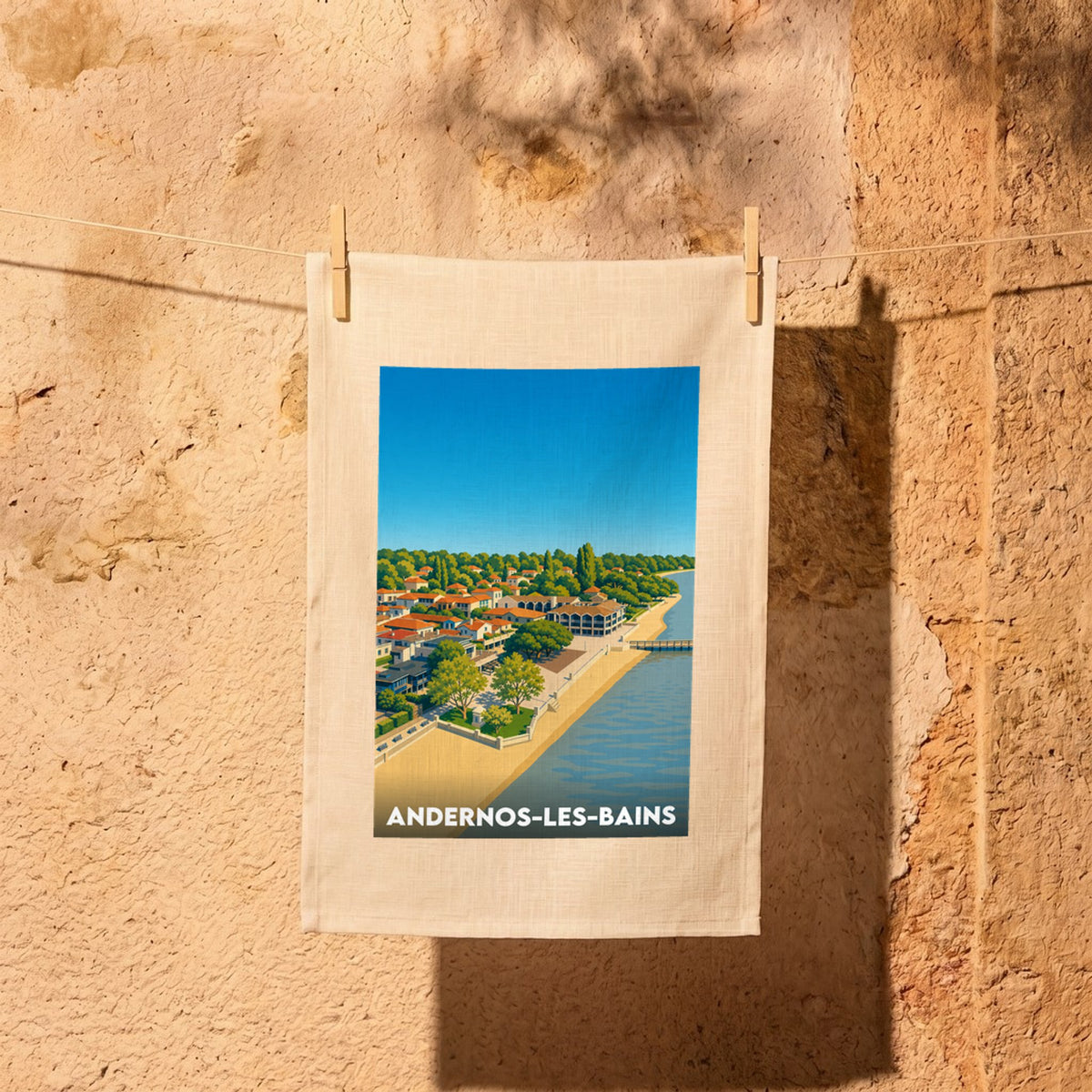 Torchon souvenir de la ville de Andernos-les-Bains avec une illustration stylisée de son front de mer.