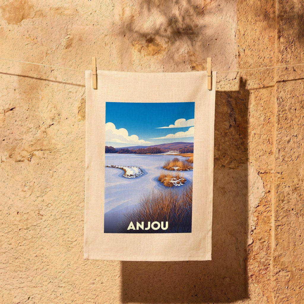 Torchon souvenir de la ville d'Anjou avec une illustration stylisée de paysage fluvial.