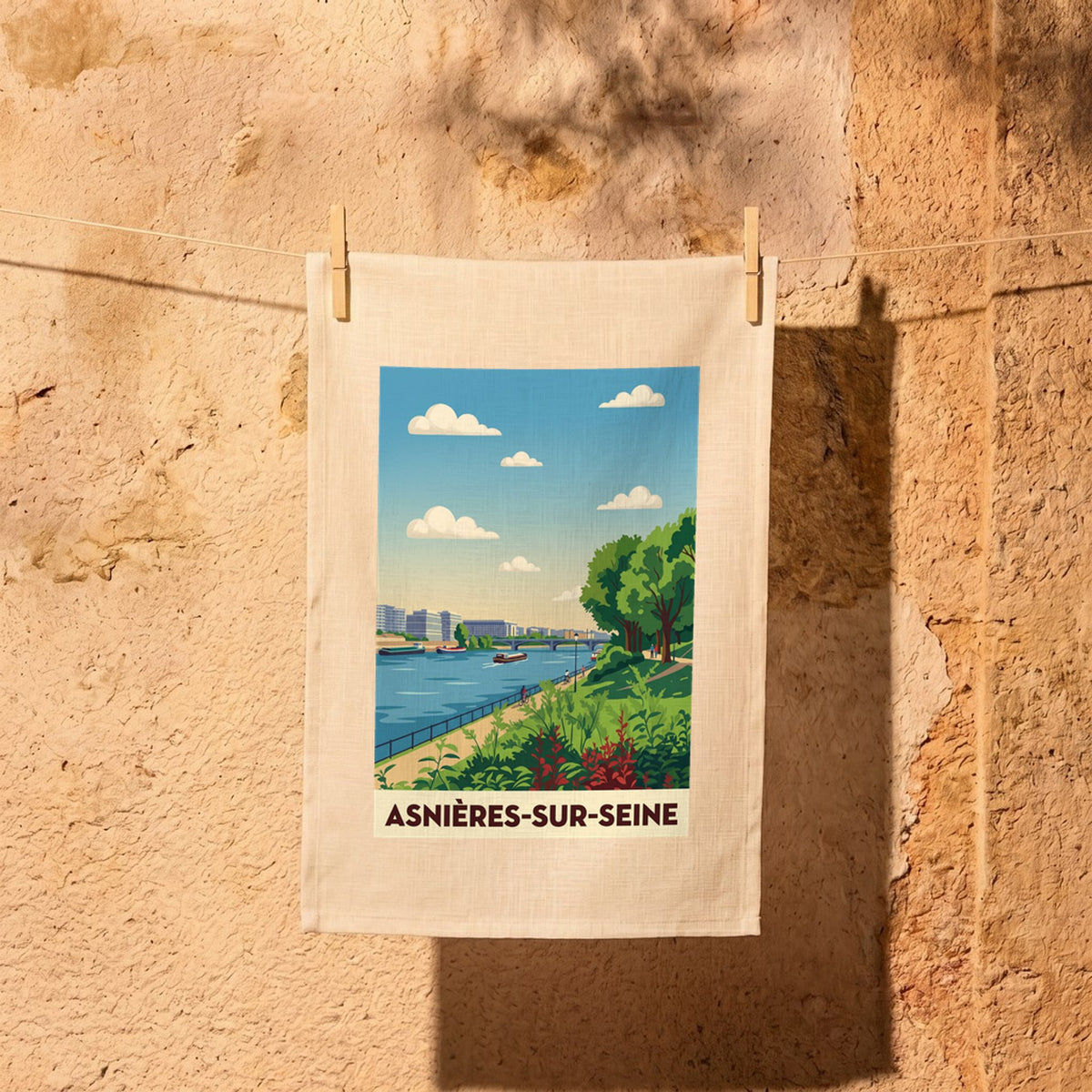 Torchon souvenir de la ville d'Asnières-sur-Seine avec une illustration stylisée des bords de Seine.