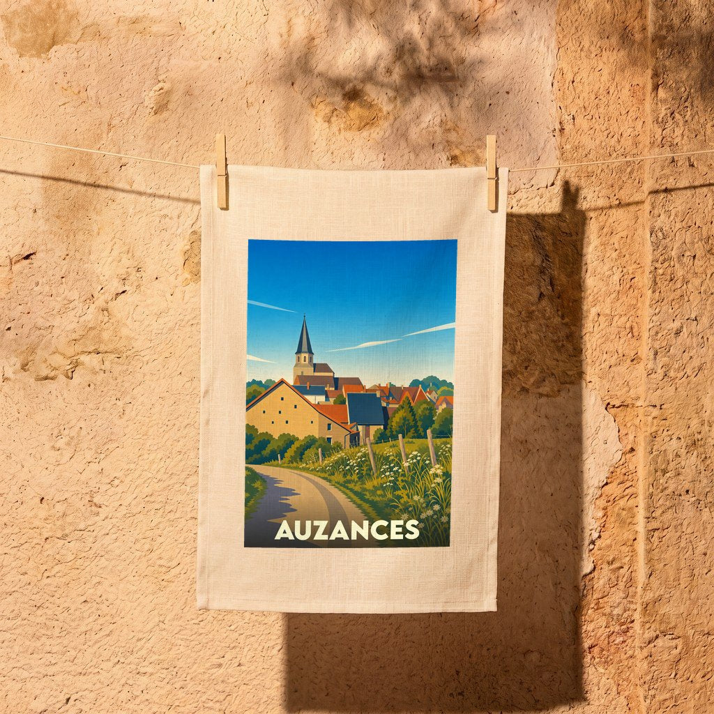 Torchon souvenir de la ville d'Auzances illustré d'un paysage de campagne stylisé.