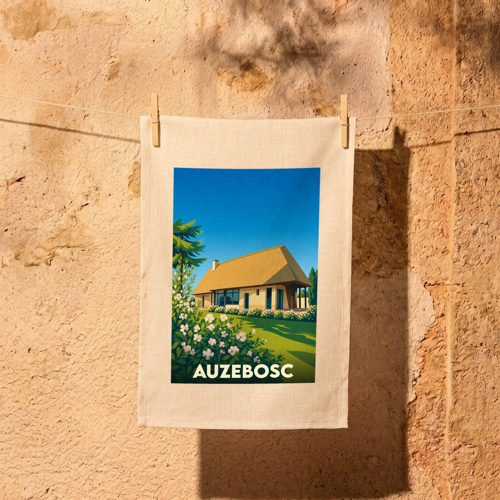 Torchon souvenir de la ville d'Auzebosc illustré d'une chaumière normande stylisée.