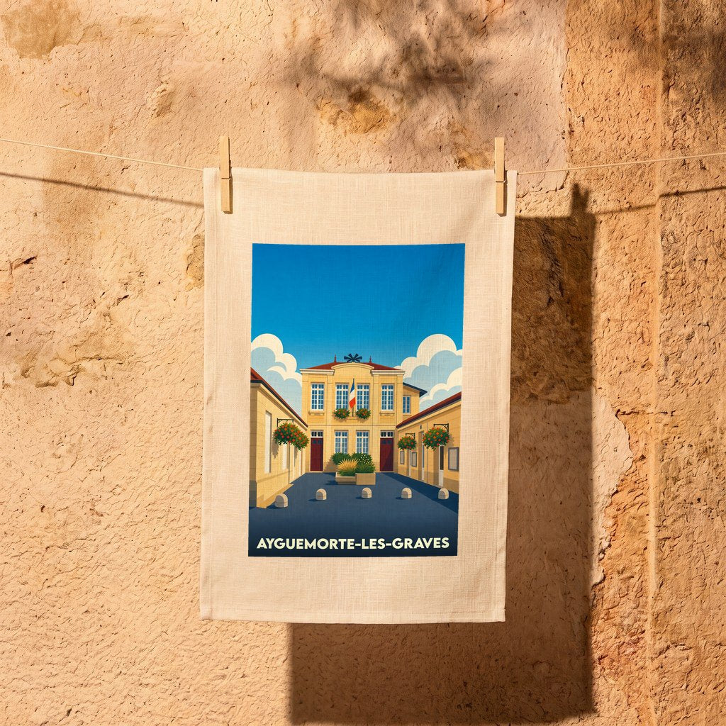 Torchon souvenir de la ville d'Ayguemorte-les-Graves avec une illustration stylisée de sa mairie.