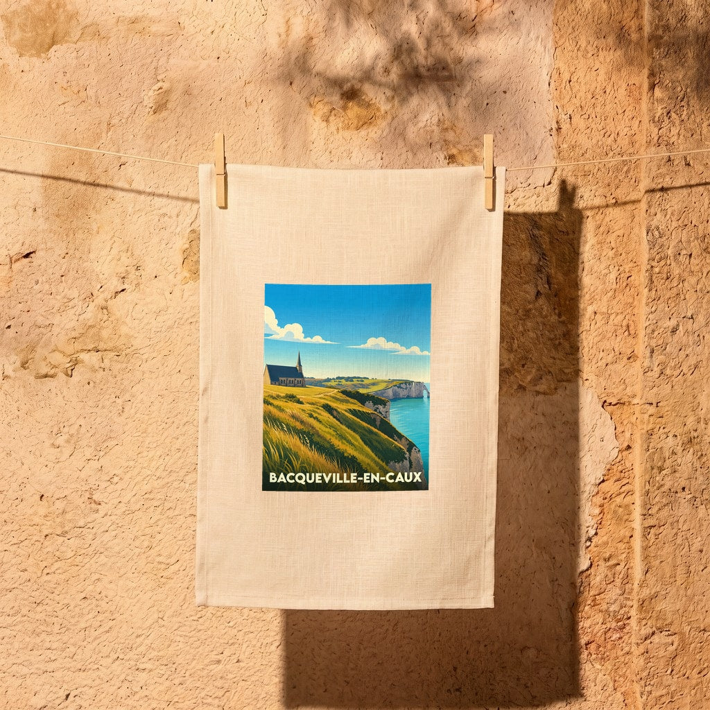 Torchon souvenir de Bacqueville-en-Caux illustré d'un paysage de falaises et d'une église en bord de mer.