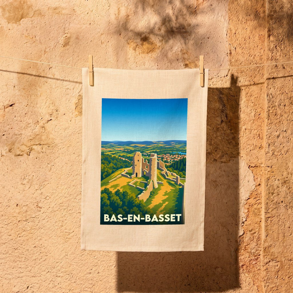 Torchon souvenir de la ville de Bas-en-Basset illustrant les ruines du château de Rochebaron dans un style graphique épuré.