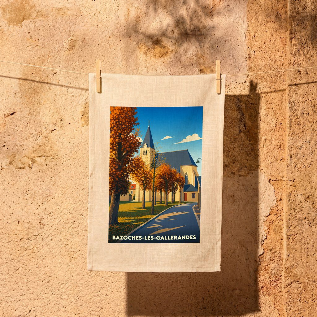 Torchon souvenir de la ville de Bazoches-les-Gallerandes orné d'une illustration stylisée de son église en automne.