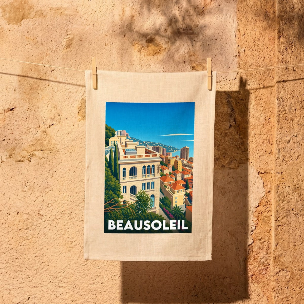 Torchon souvenir de la ville de Beausoleil avec une illustration stylisée.