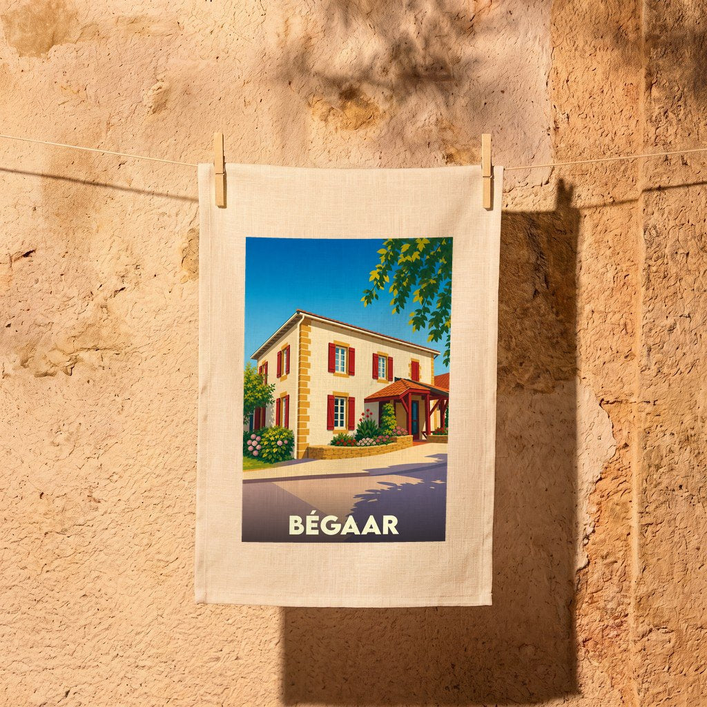 Torchon souvenir de la ville de Bégaar avec une illustration stylisée d'une maison traditionnelle.