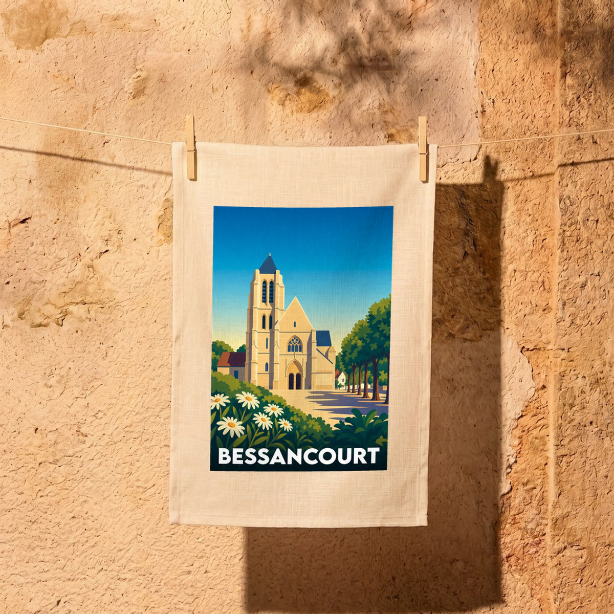 Torchon souvenir de la ville de Bessancourt avec une illustration stylisée de son église et de ses environs.