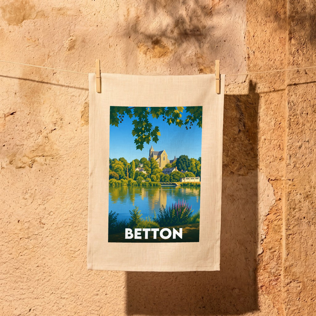 Torchon souvenir de la ville de Betton avec une illustration stylisée.