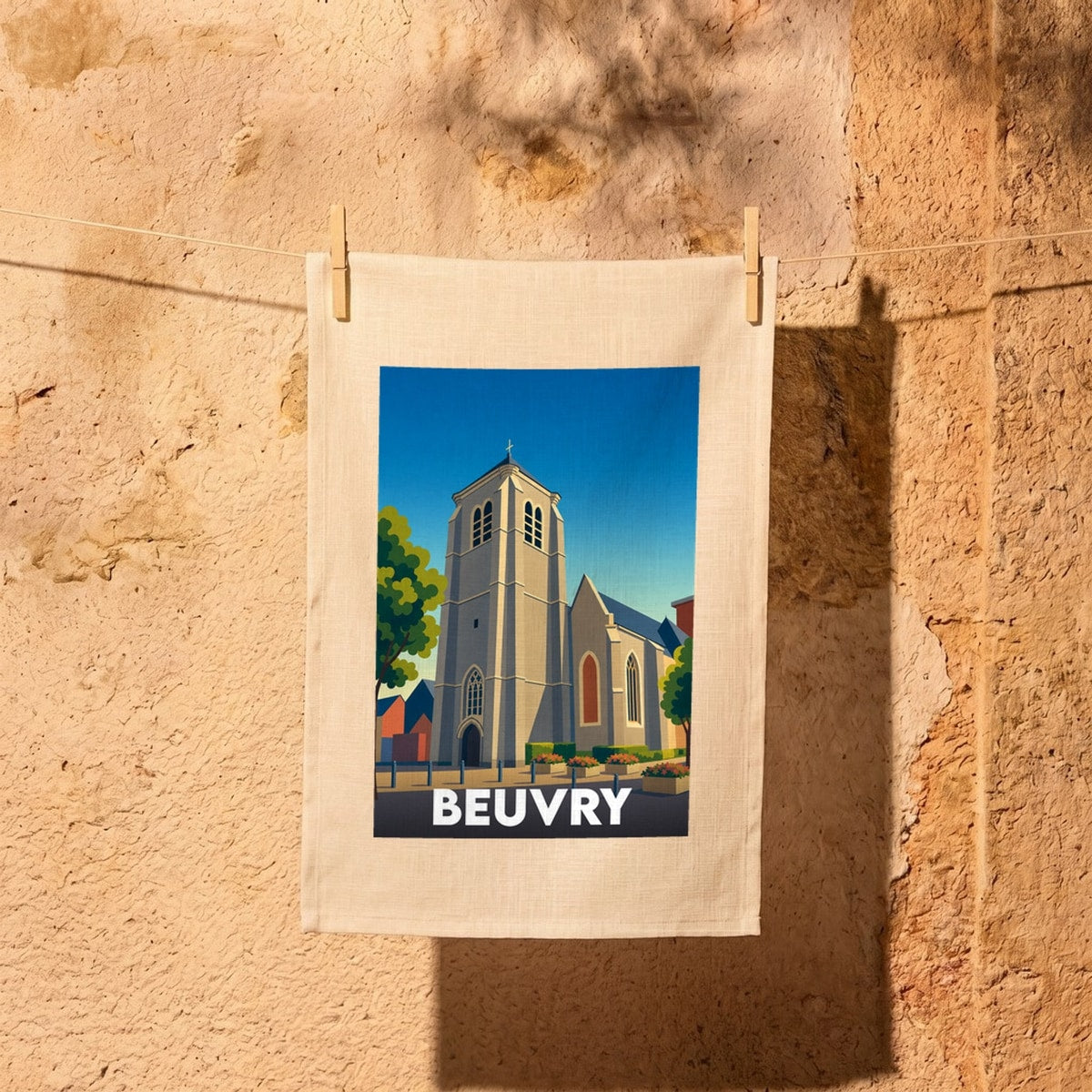 Torchon souvenir de la ville de Beuvry avec une illustration stylisée de son église et de ses maisons.