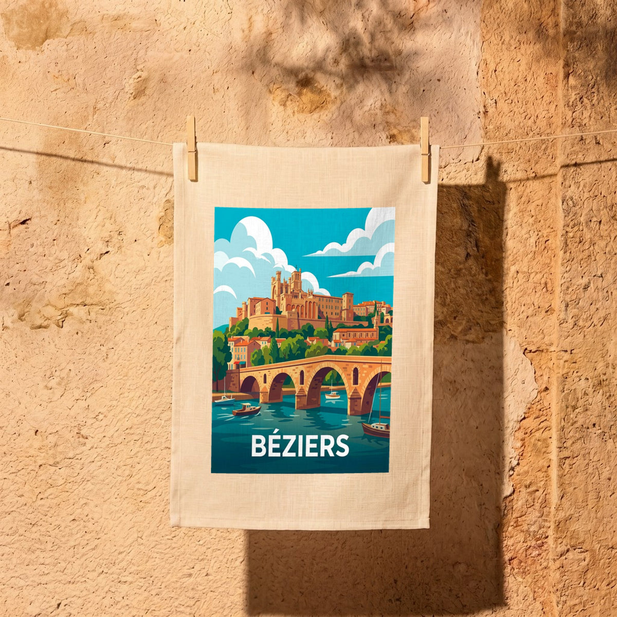 Torchon souvenir de la ville de Béziers avec une illustration stylisée du Pont Vieux et de sa cathédrale.