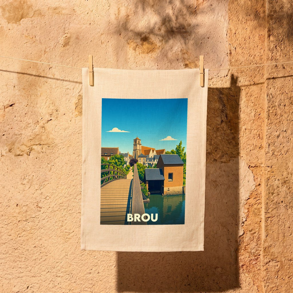 Torchon souvenir de la ville de Brou avec une illustration stylisée d'un pont et d'une église.
