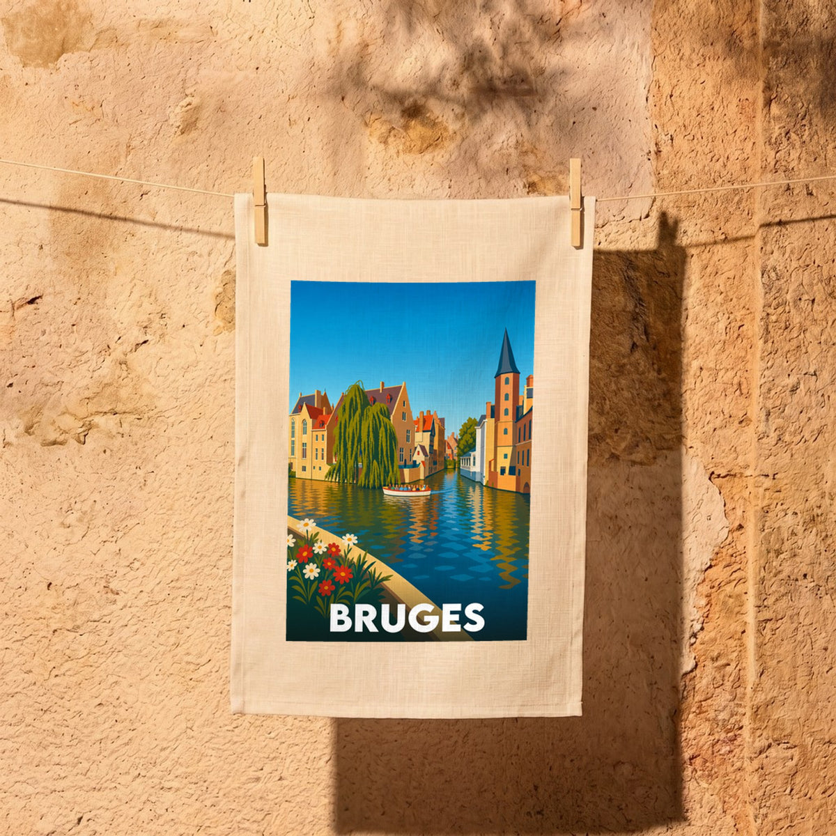 Torchon souvenir de la ville de Bruges avec une illustration stylisée de ses canaux.