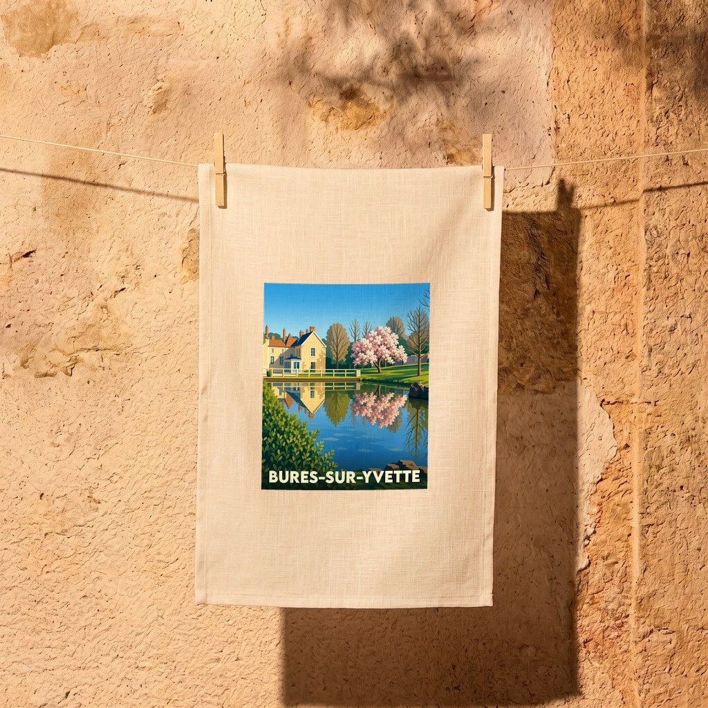 Torchon souvenir de la ville de Bures-sur-Yvette illustré d'un paysage de parc avec un manoir se reflétant dans l'eau.