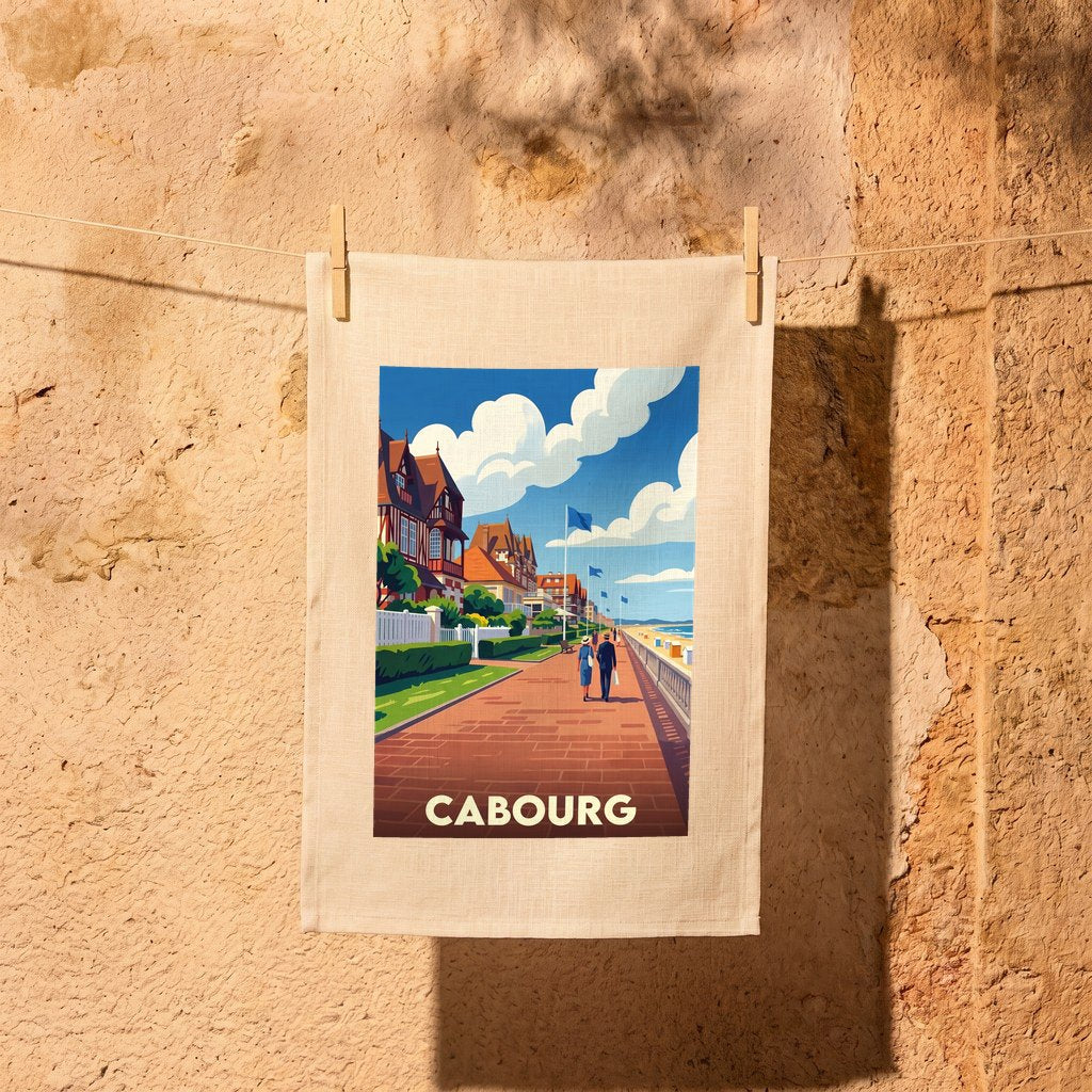 Torchon souvenir de la ville de Cabourg avec une illustration stylisée de son front de mer.