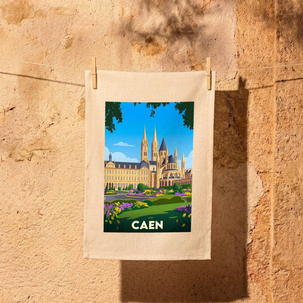 Torchon souvenir de la ville de Caen avec une illustration stylisée de l'Abbaye-aux-Hommes et de ses jardins.
