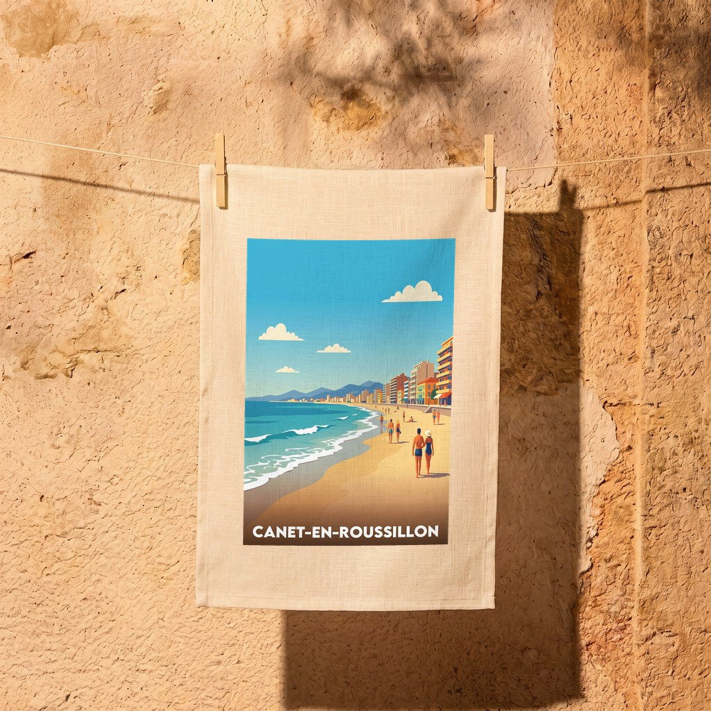 Torchon souvenir de la ville de Canet-en-Roussillon avec une illustration stylisée de sa plage.