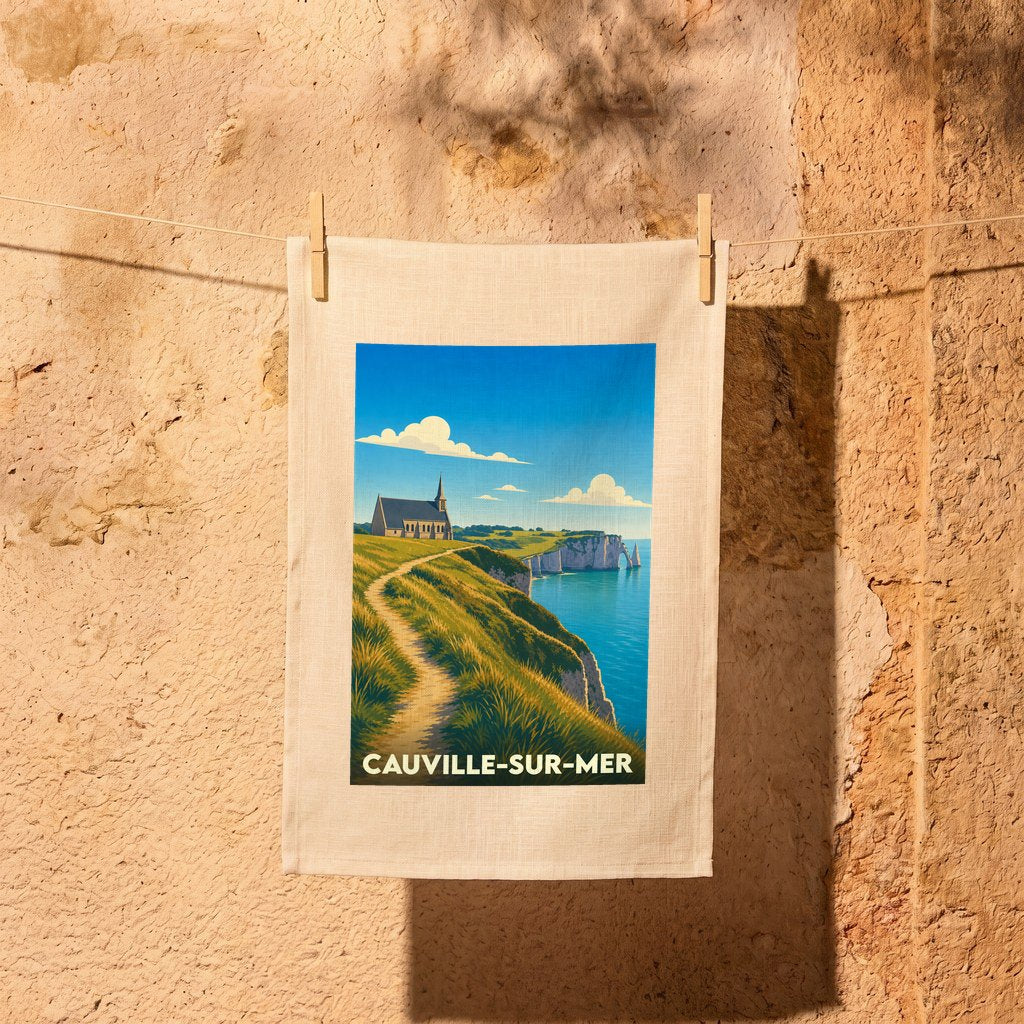 Torchon souvenir de la ville de Cauville-sur-Mer avec une illustration stylisée de son église et de ses falaises.