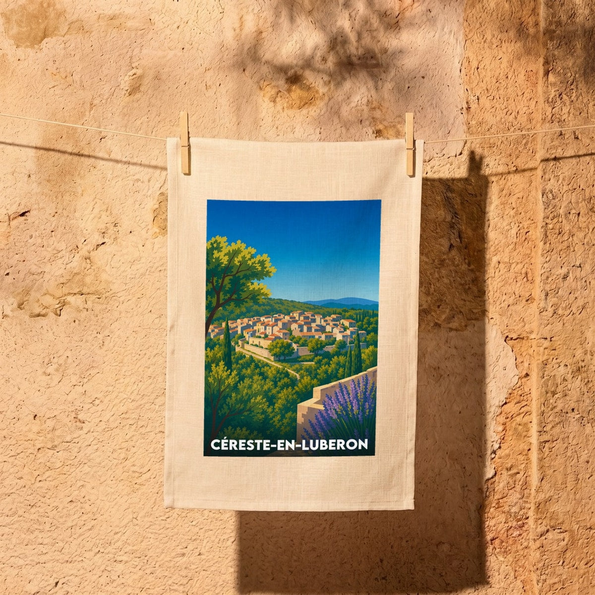 Torchon souvenir de la ville de Céreste-en-Luberon avec une illustration stylisée.