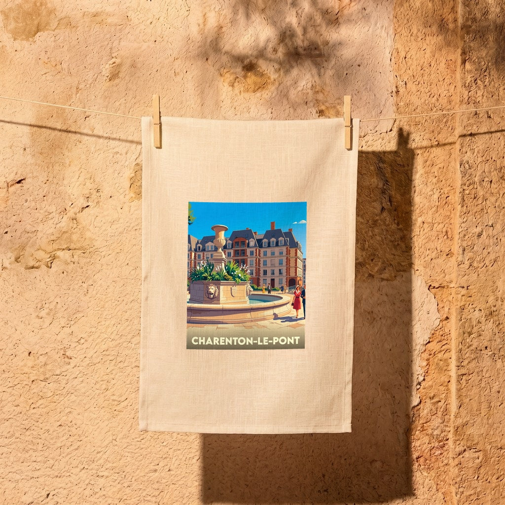 Torchon souvenir de la ville de Charenton-le-Pont avec une illustration stylisée d'une fontaine et de bâtiments.