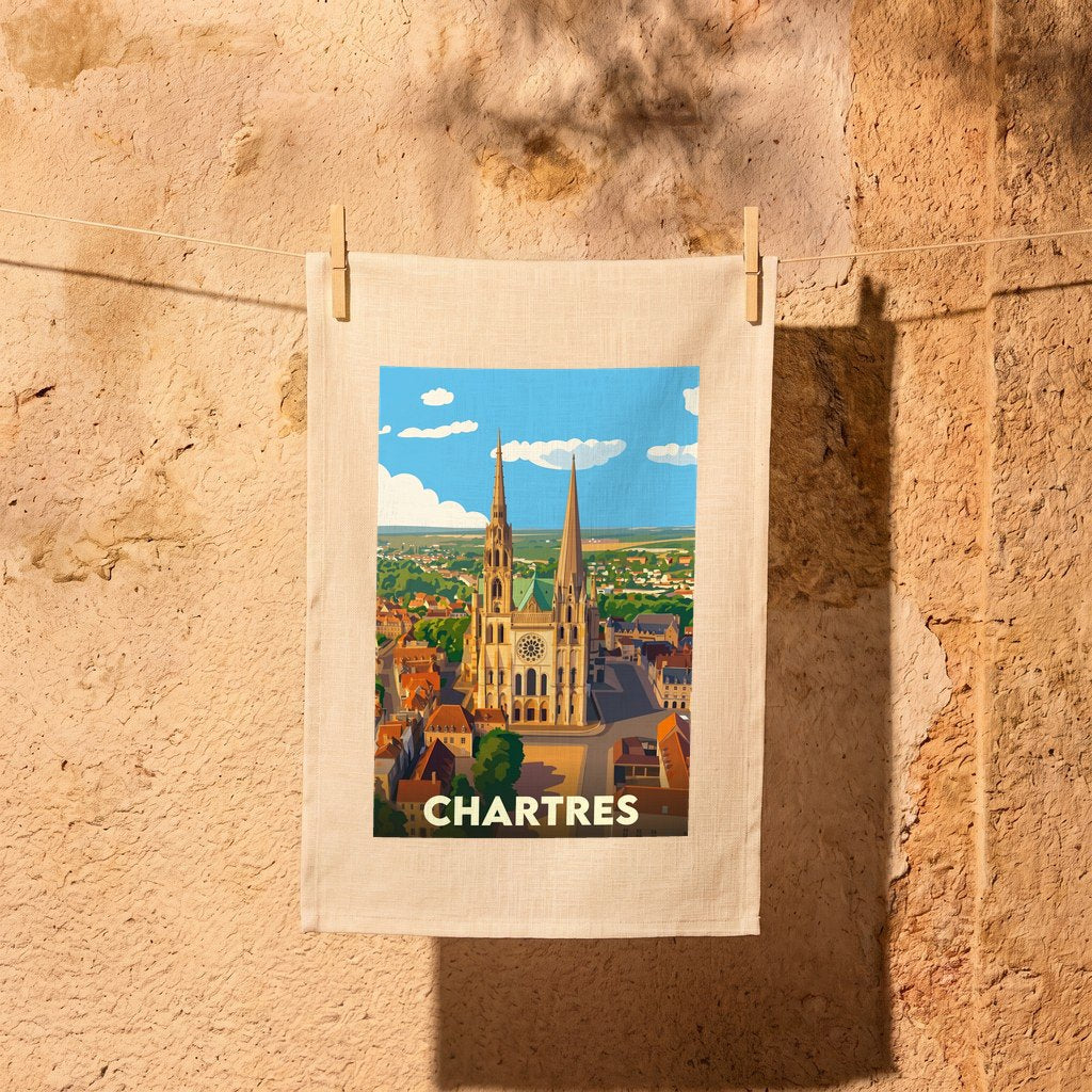 Torchon souvenir de la ville de Chartres avec une illustration stylisée de sa cathédrale.