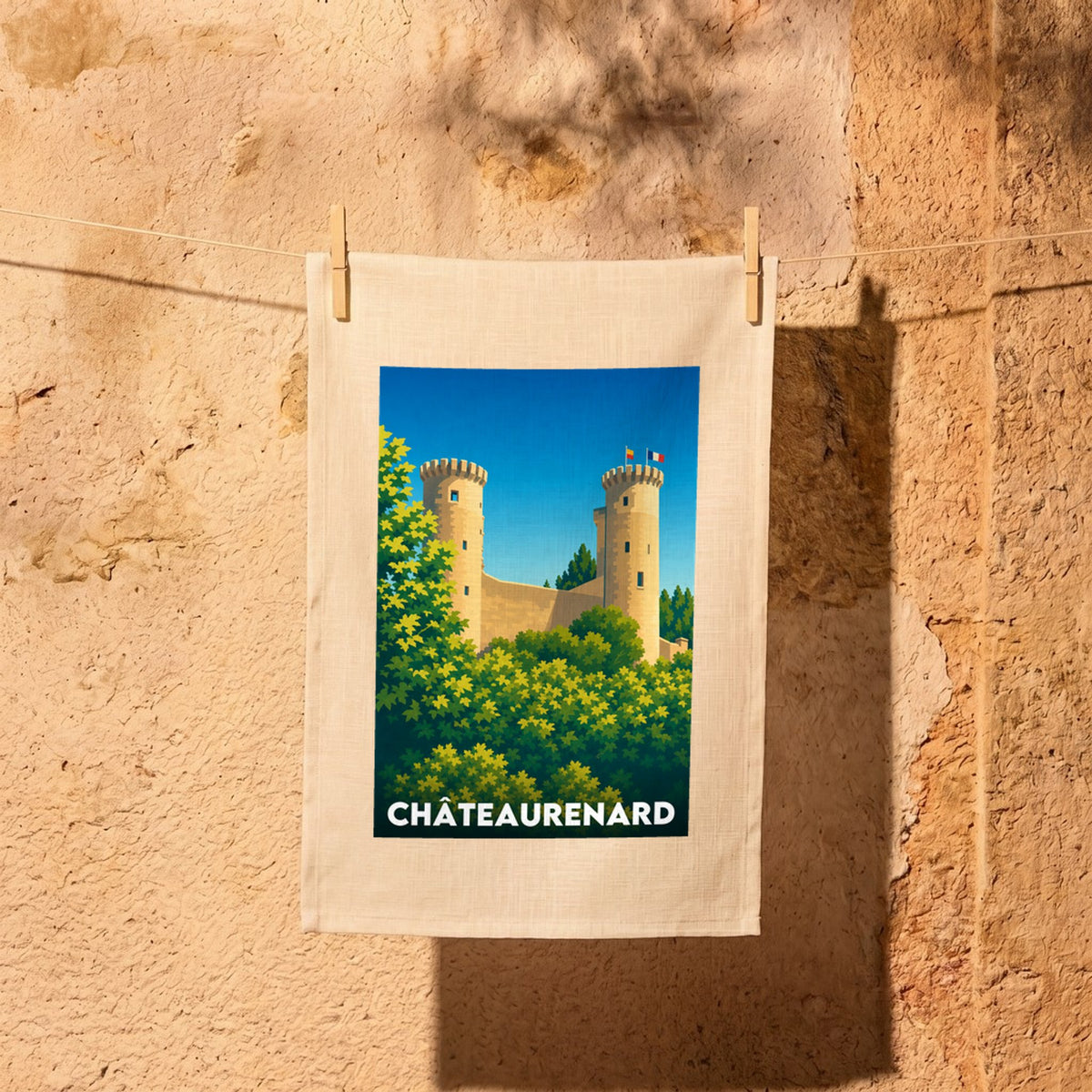 Torchon souvenir de la ville de Châteaurenard illustrant son château médiéval dans un style graphique épuré.