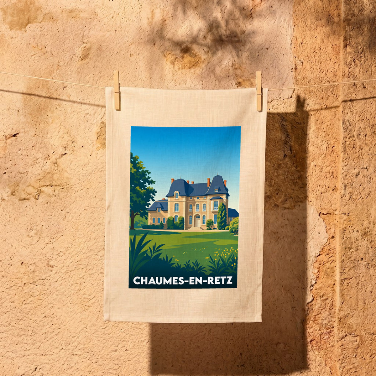 Torchon souvenir de la ville de Chaumes-en-Retz avec une illustration stylisée d'un château.