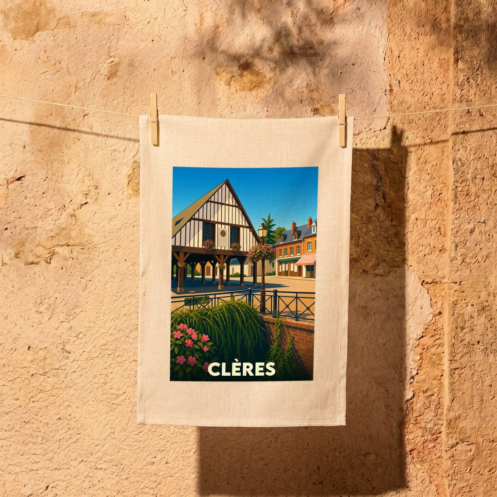 Torchon souvenir de la ville de Clères illustrant son architecture traditionnelle à colombages.