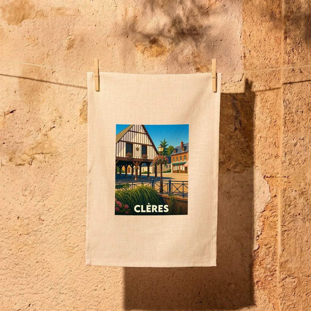 Torchon souvenir de la ville de Clères illustrant son architecture traditionnelle à colombages.