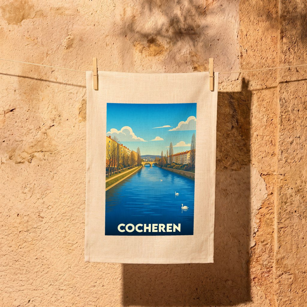 Torchon souvenir de la ville de Cocheren avec une illustration stylisée d'un canal et de cygnes.