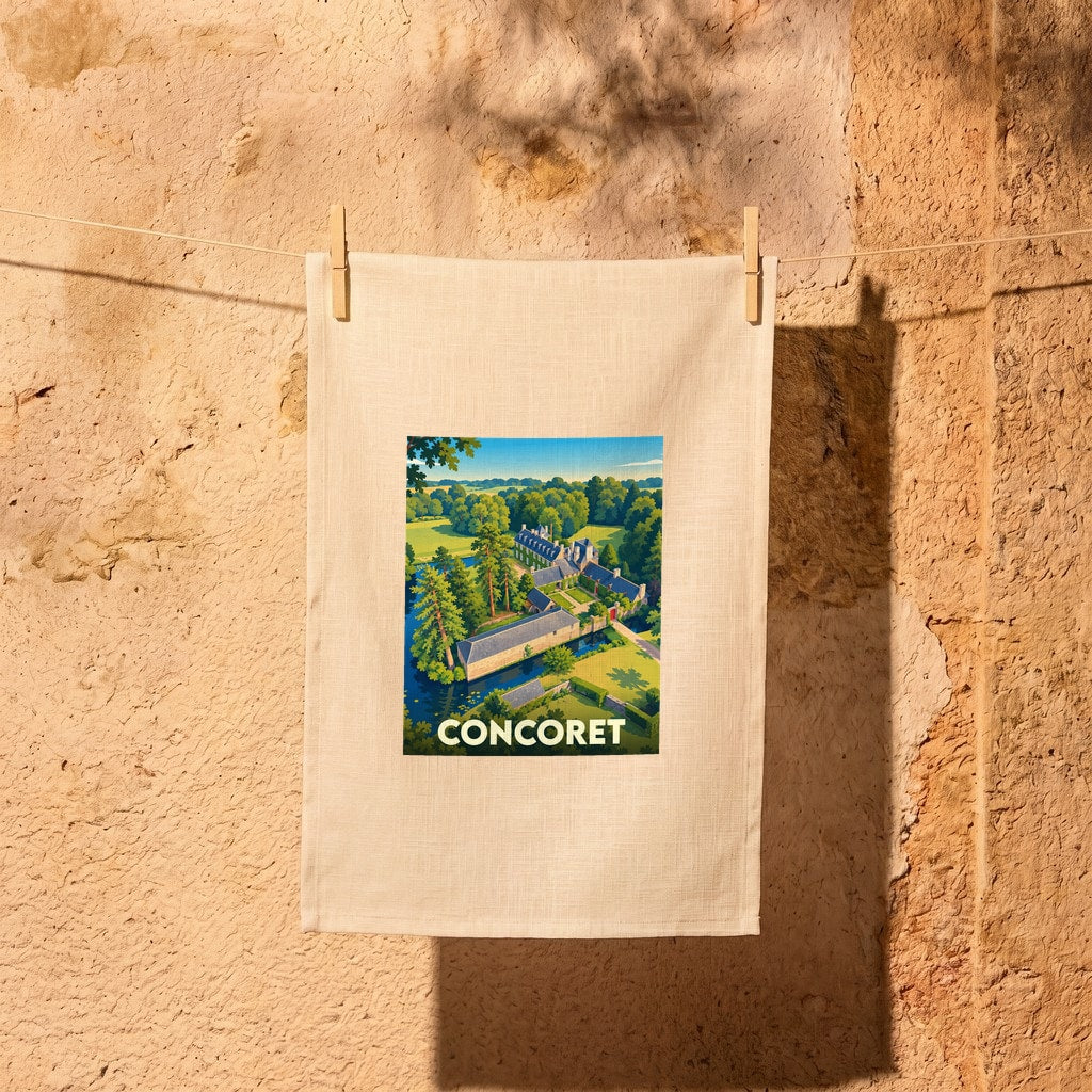 Torchon souvenir de la ville de Concoret avec une illustration stylisée d'un château entouré de verdure.